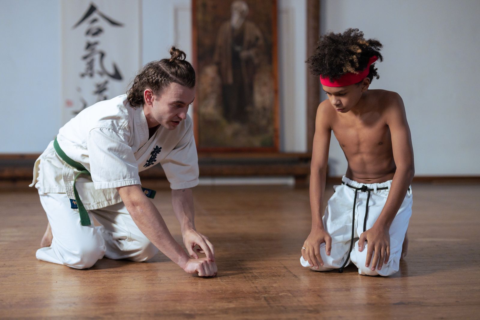 instructor demonstrating technique to a student