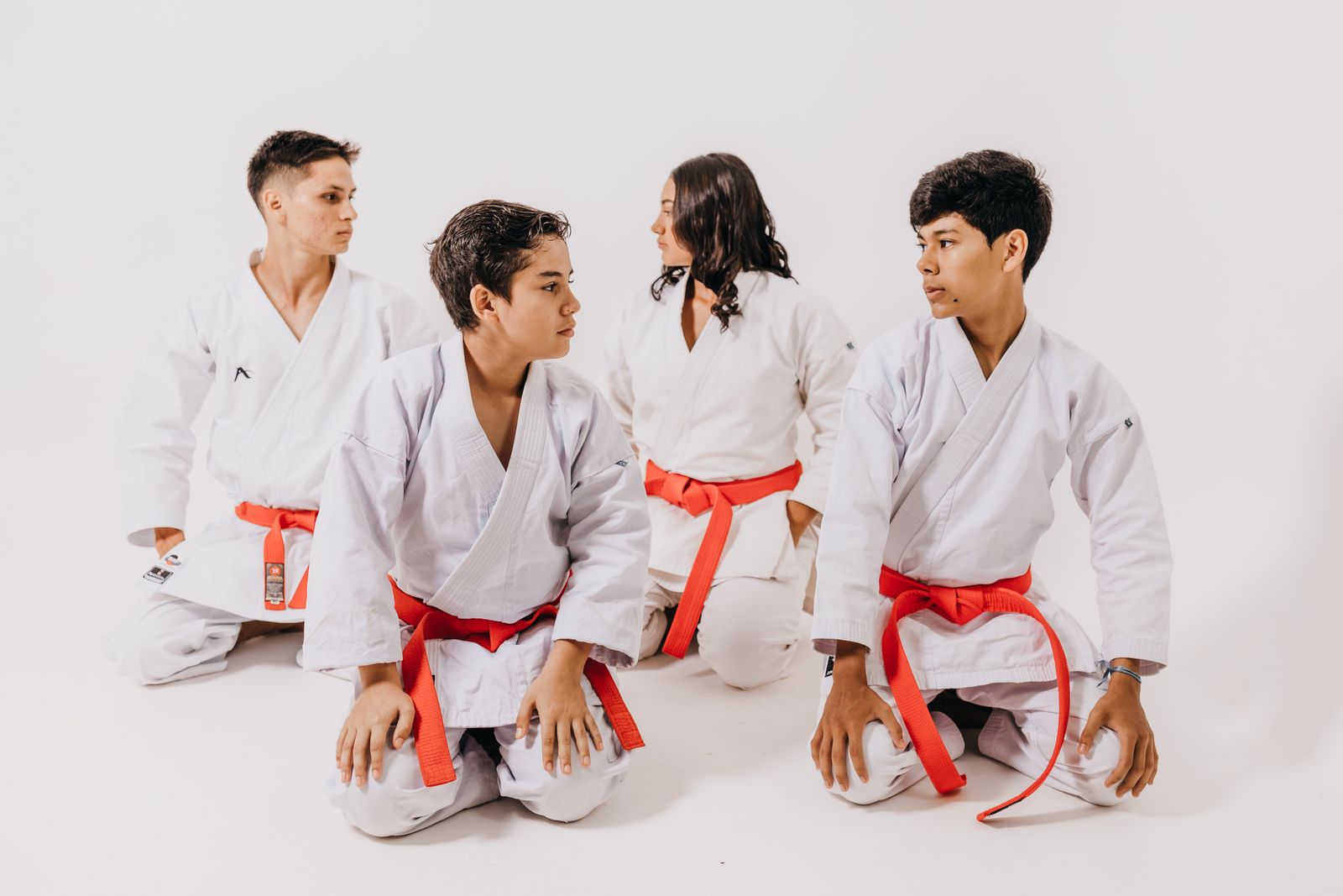 students practicing martial arts technique in class